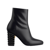 Block Heel Kit 4 Coal Stud shown on the Amy Bootie Coal Stretch Leather upper. Pashion convertible heels go from heel to flat and are customizable with interchangeable heel kits.