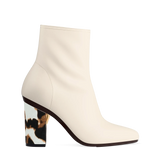 Block Heel Kit 4 Cow Print shown on the Amy Bootie Ivory Stretch Leather upper. Pashion convertible heels go from heel to flat and are customizable with interchangeable heel kits.