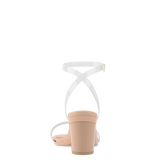 back view of a transaprent strappy sandal with block heel and a beige footbed