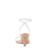 back view of convertible transaprent strappy high heel sandal with a beige footbed