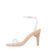 side view of convertible transaprent strappy high heel stiletto sandal with a beige footbed