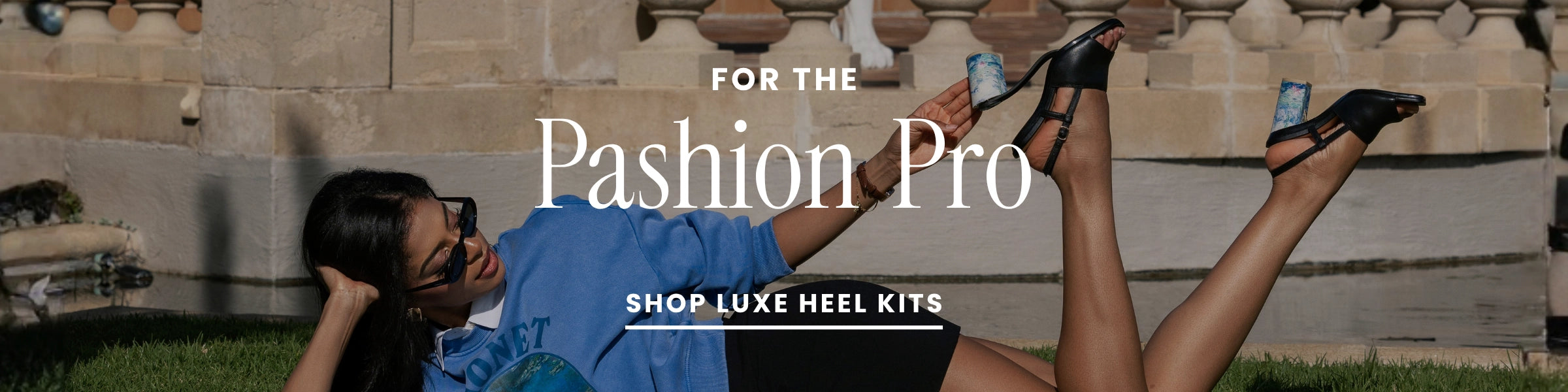 Person sitting on grass wearing convertible high heels with promotional text for 'Luxe Heel Kits'.