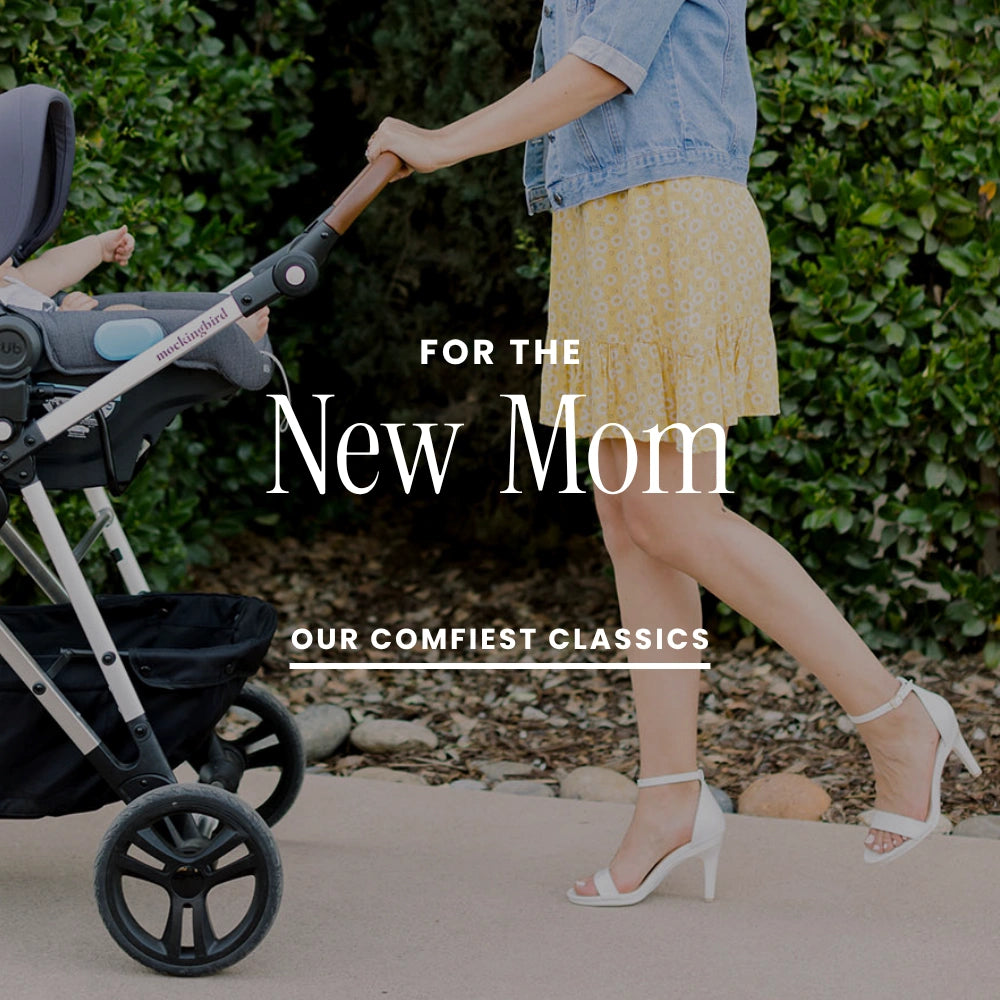 Woman pushing a stroller in high heels with text overlay 'For the New Mom' and 'Our Comfiest Classics'.